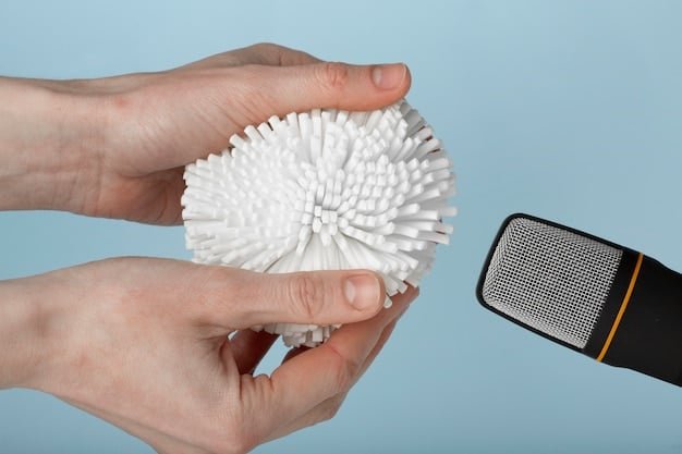 A beauty sponge being squeezed under a running tap, visibly expanding in size as it absorbs water, demonstrating the correct way to dampen the sponge before use.